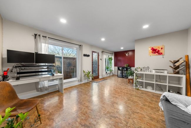Den featuring an open space for a home office, library or family room | Image 15