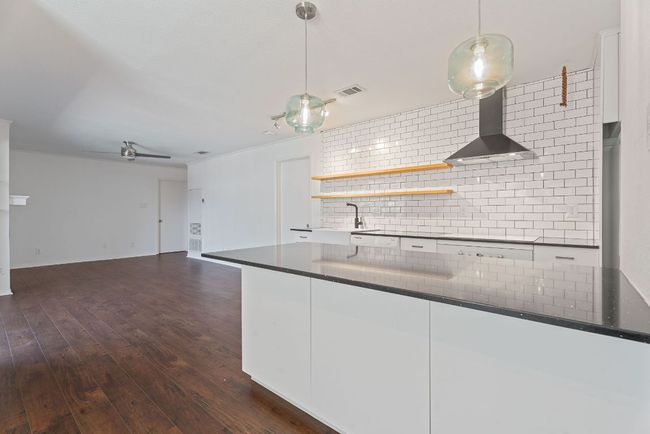 Everyone will want to gather around the inviting bar seating along the spacious kitchen peninsula. | Image 10
