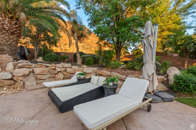 Fenced backyard featuring a patio area and outdoor lounge area | Image 57