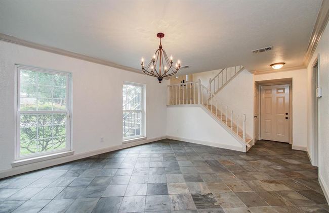 Living room on first floor offers privacy from second floor. | Image 4