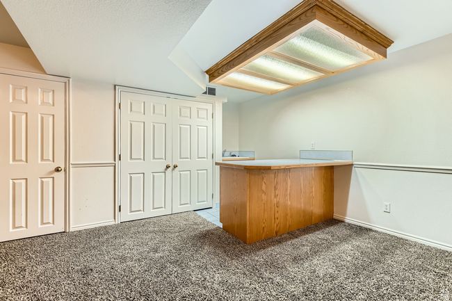 Bar area featuring carpet floors and baseboards | Image 19