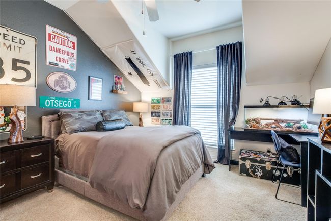 Bedroom with carpet, ceiling fan, and lofted ceiling | Image 17
