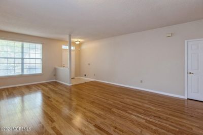 Living room with Gorgeous hardwood. | Image 2