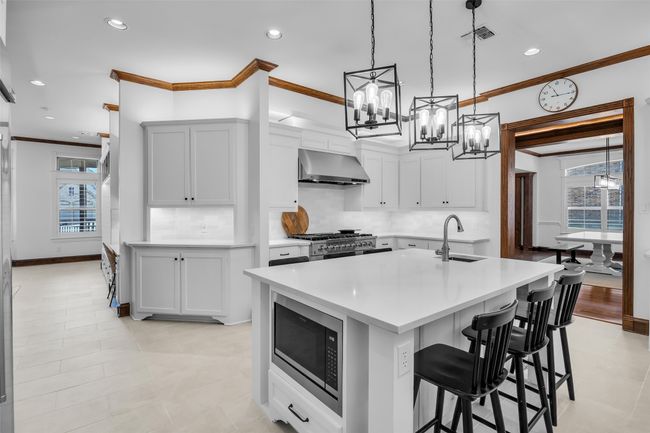 Microwave is built into the island. Butler's pantry for more storage. View into the breakfast room | Image 14