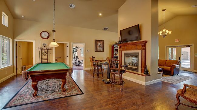 Clubhouse for Members includes, pool table, fooseball table, poker table, gym with mirror and nice sitting areas by the fireplace. | Image 11