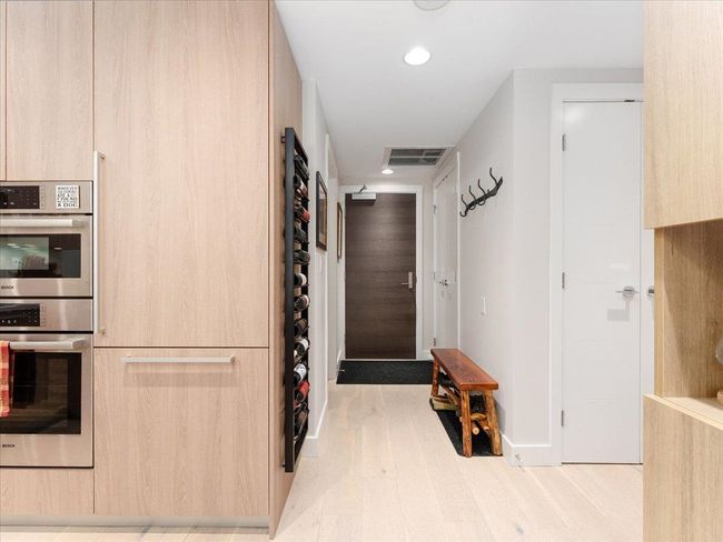 Hallway featuring wood finished floors, recessed lighting, and baseboards | Image 13