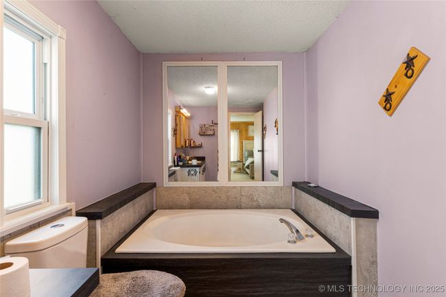Primary bath with soaker tub and separate tiled shower | Image 27