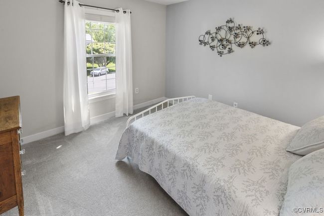 Carpeted bedroom with baseboards | Image 32
