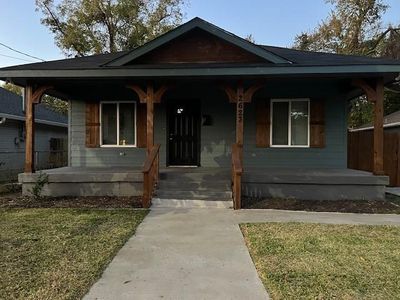 Bungalow-style house featuring a front lawn and a porch | Image 1