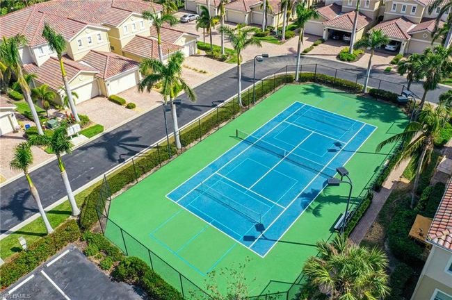 View of sport court with a residential view and fence | Image 37