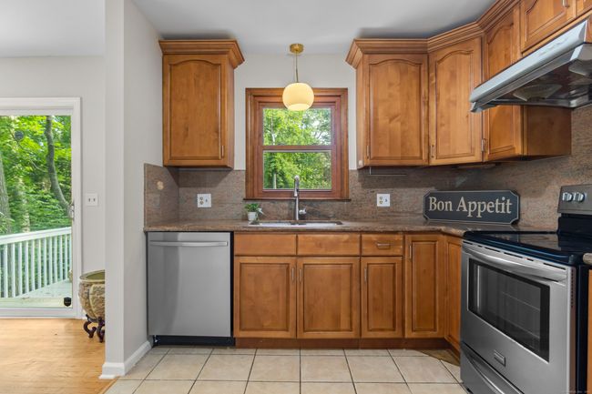 Updated kitchen with granite countertops custom cabinets, new dishwasher and new garbage disposal! | Image 9