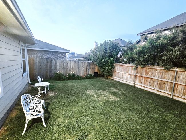 View of fenced backyard | Image 21