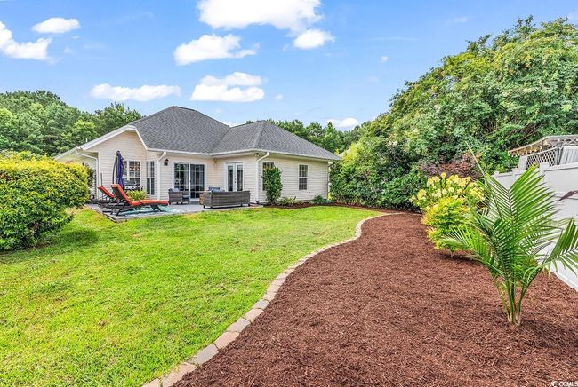 Back of house with outdoor lounge area and a patio | Image 32