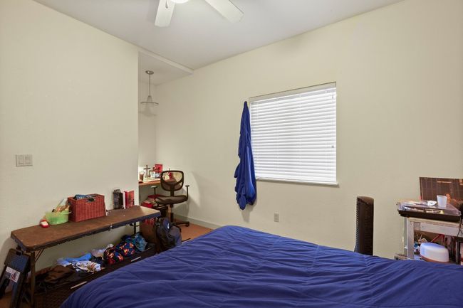 Bedroom featuring ceiling fan and baseboards | Image 11