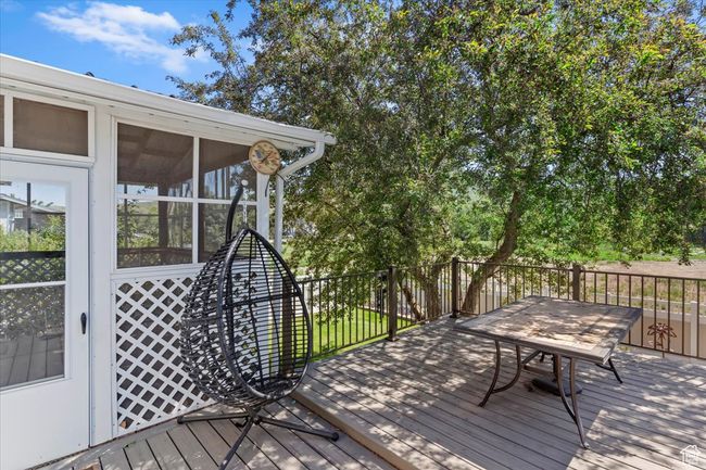 Wooden terrace featuring a sunroom | Image 26