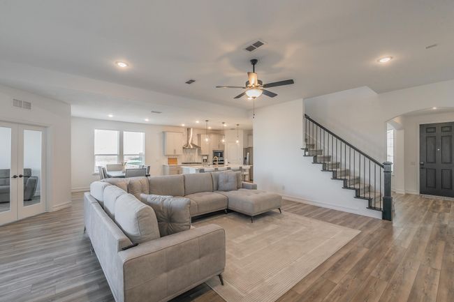 Living room featuring french doors, light hardwood / wood-style flooring, and ceiling fan | Image 17