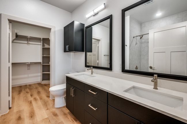 Full bath featuring toilet, wood finished floors, visible vents, and a sink | Image 6