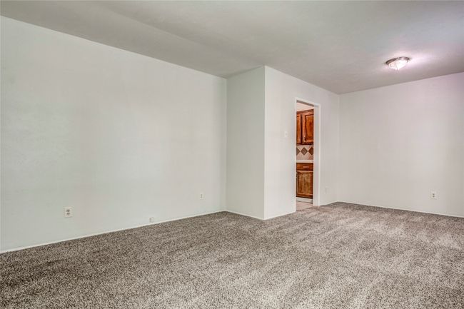 Unfurnished room with light colored carpet | Image 7