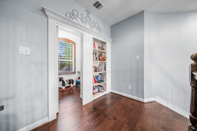 Built-in bookshelves in the gameroom lead to the awesome secret room, which is excellent for extra storage, etc.! | Image 29