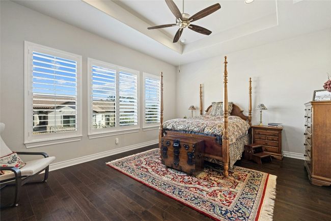 Primary bedroom with wood flooring | Image 7