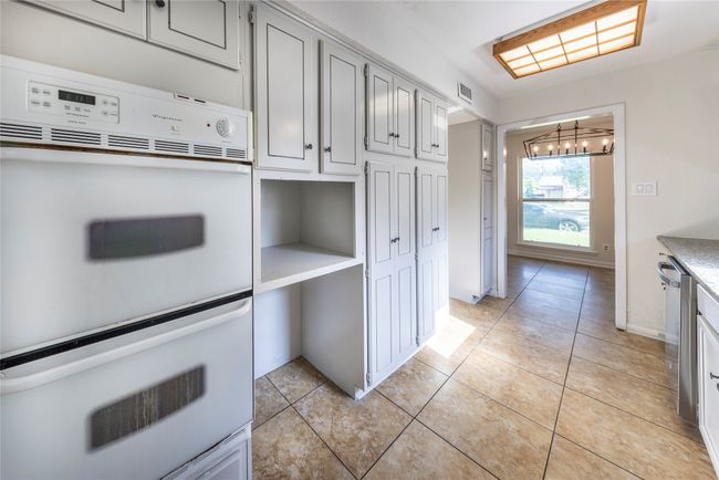 Double ovens with built in space for microwave or appliance storage. | Image 12