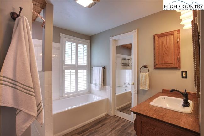 Large ensuite added off the primary. Mirrored door is entry to the large closet. | Image 26