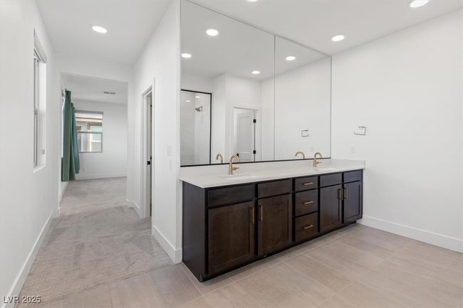 Bathroom with recessed lighting, double vanity, a sink, and baseboards | Image 39