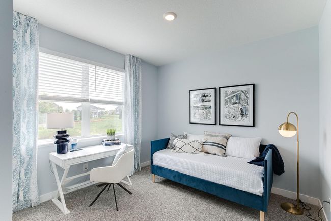 Main level bedroom perfect as a full time bedroom, guest bedroom or an office. | Image 13