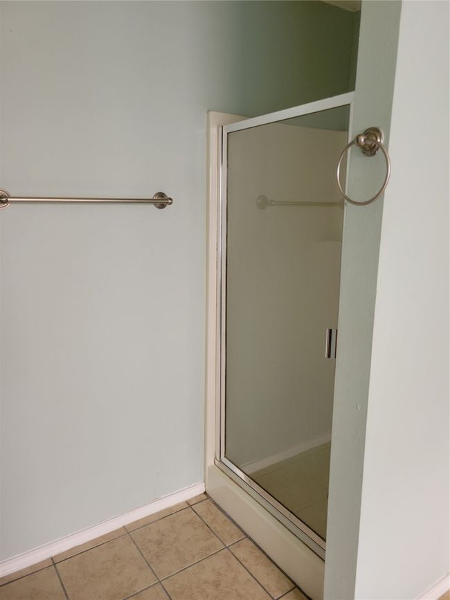 Full bathroom with tile patterned flooring and a stall shower | Image 20