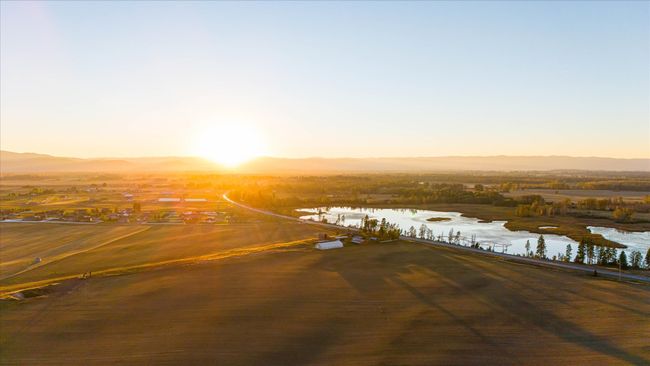 Aerial view at dusk featuring a water and mountain view | Image 70