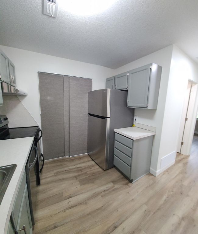 All appliances are stainless steel. Laundry, water heater, and furnace are all located in the kitchen. Stacked washer/dryer combo. | Image 9