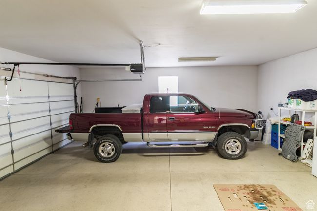Garage featuring a garage door opener | Image 21