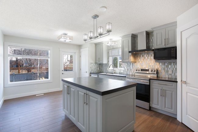 432 Rocky Ridge Drive Nw, House other with 5 bedrooms, 3 bathrooms and 4 parking in Calgary AB | Image 6
