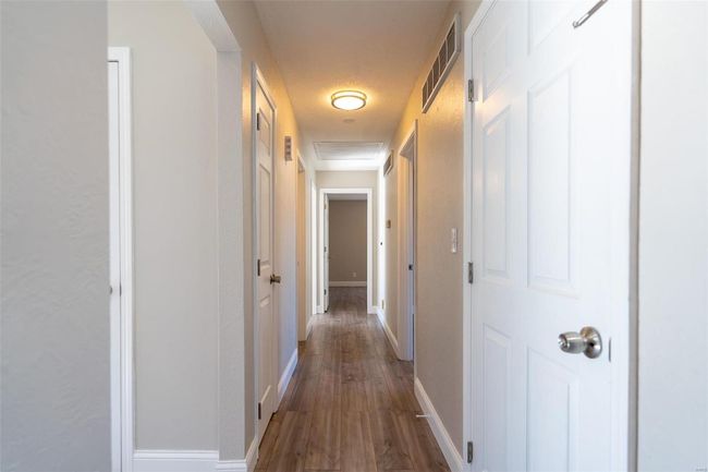 Hall with dark wood-type flooring | Image 45