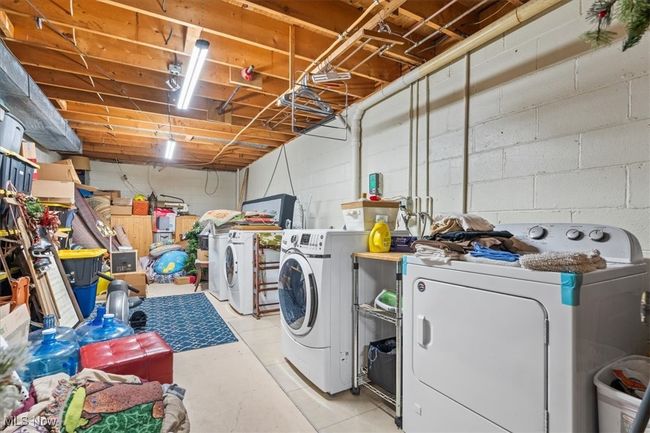 Laundry area in basement | Image 44