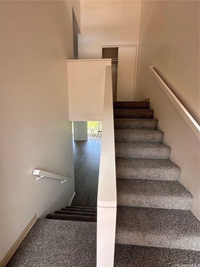 Stairway connecting the main living area to the bedrooms upstairs | Image 9