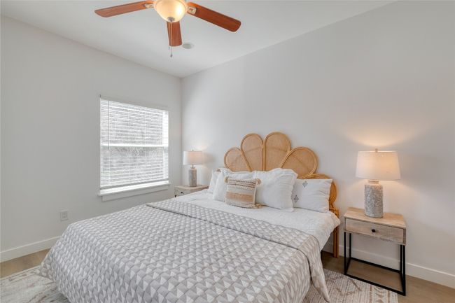 Bedroom featuring wood finished floors and a ceiling fan | Image 9