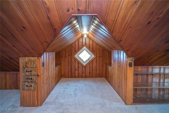 Additional living space with carpet, lofted ceiling, wooden walls, and wooden ceiling | Image 28