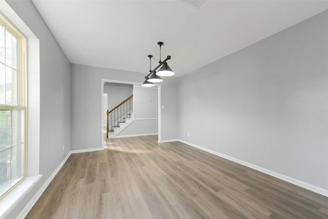 Bright and versatile game-room/study with elegant hardwood floors and ample natural light. | Image 29