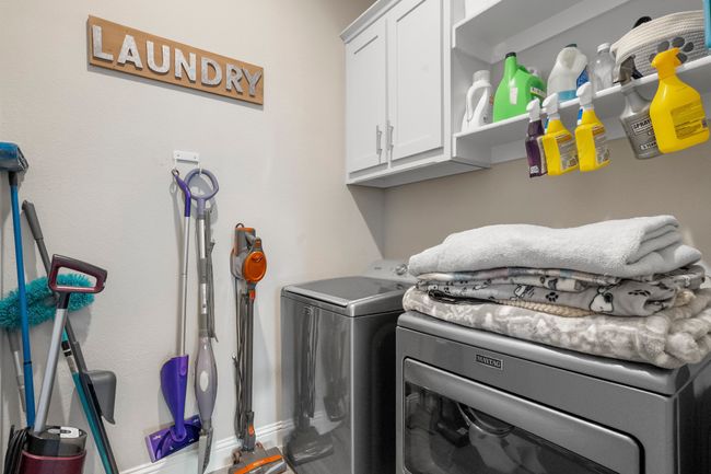 Laundry room with cabinet space and washer and dryer | Image 18