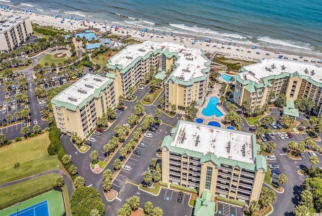 View of property location featuring unending shoreline and apartment complex / building | Image 36