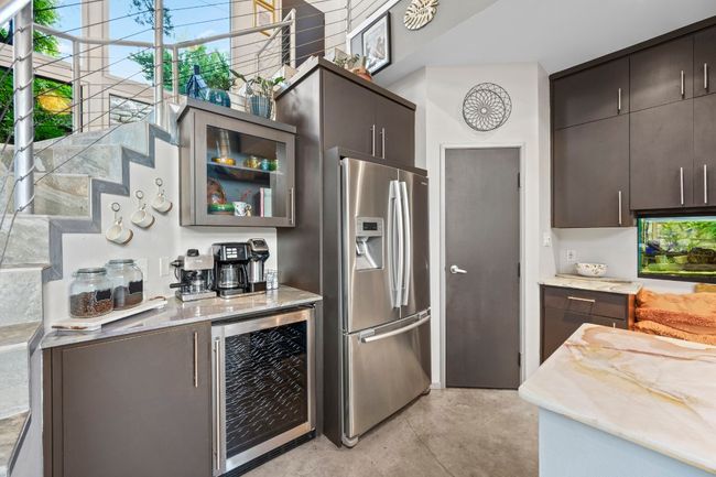 Wine fridge and all appliances convey. Walk in panty is in the corner | Image 21