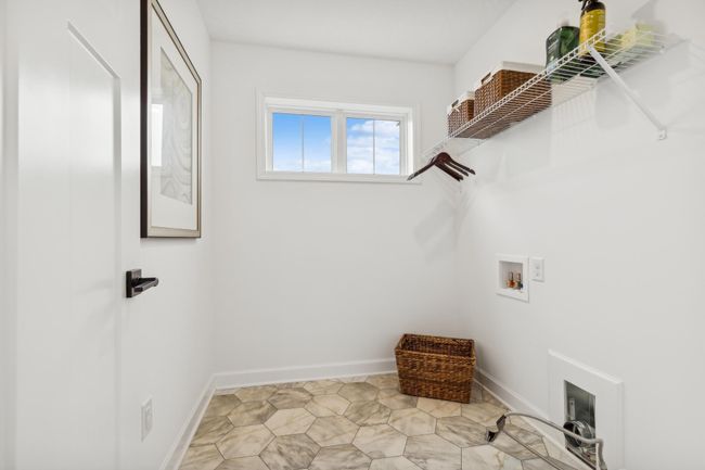 (Photo of a decorated model, actual homes finishes will vary) Fantastic upper level laundry! | Image 21