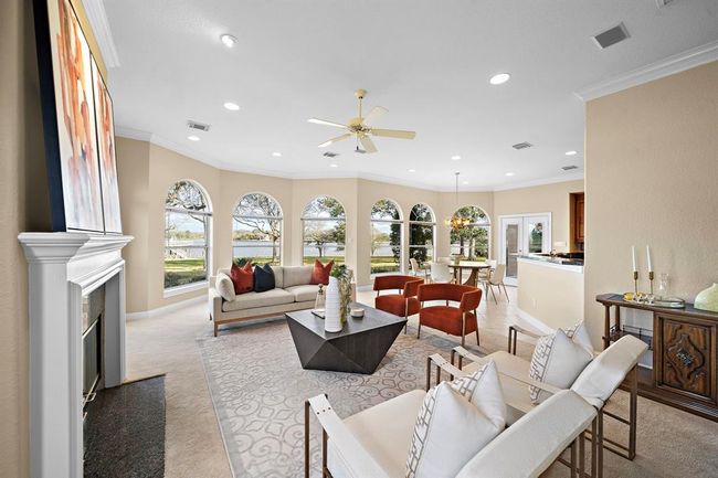 The porch entrance of this room provides a seamless transition to the outdoors, allowing guests to effortlessly step out and bask in the peaceful ambiance of your exquisite waterfront estate. | Image 17