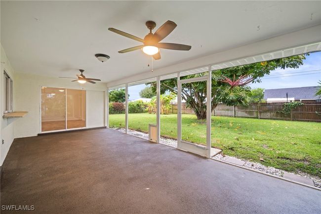 Unfurnished sunroom with a ceiling fan | Image 27