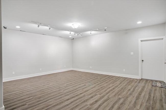 Spare room with track lighting and hardwood / wood-style flooring | Image 22