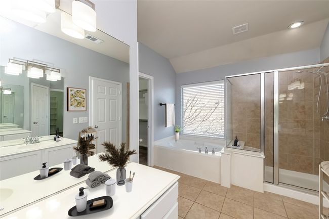 Full bath with tile patterned flooring, visible vents, a walk in closet, and a shower stall | Image 15