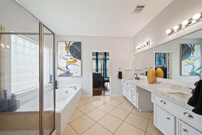 With calming tones, upgraded lighting, and thoughtful finishes throughout, this ensuite offers both function and indulgence in equal measure. | Image 28
