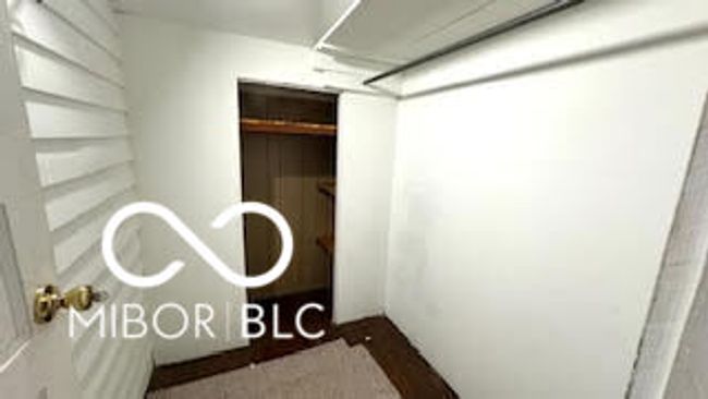 view of larg walk in bedroom closet | Image 12