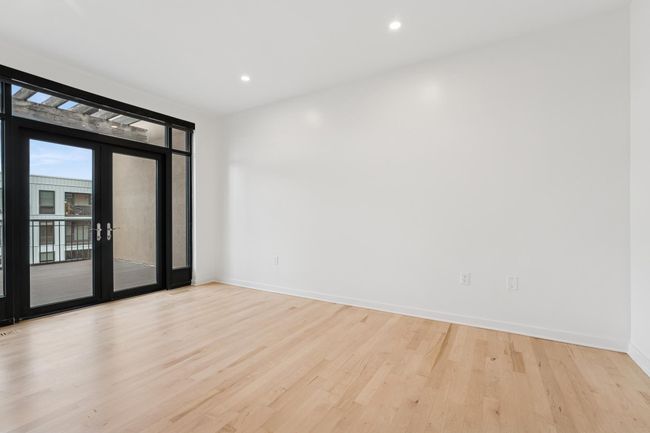 Whether used as a guest suite, office, or yoga retreat, this bedroom delivers comfort and versatility. | Image 30